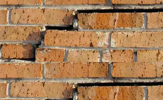 Brick wall with serious structural damage in Oakland, CA